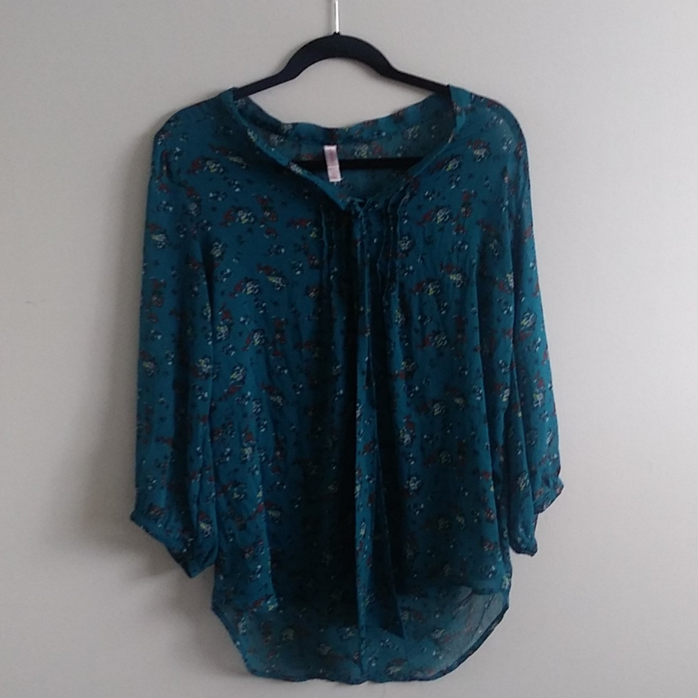 Sheer blue blouse with floral detailing